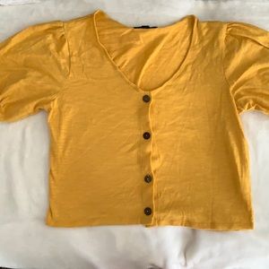 Yellow loose crop top.